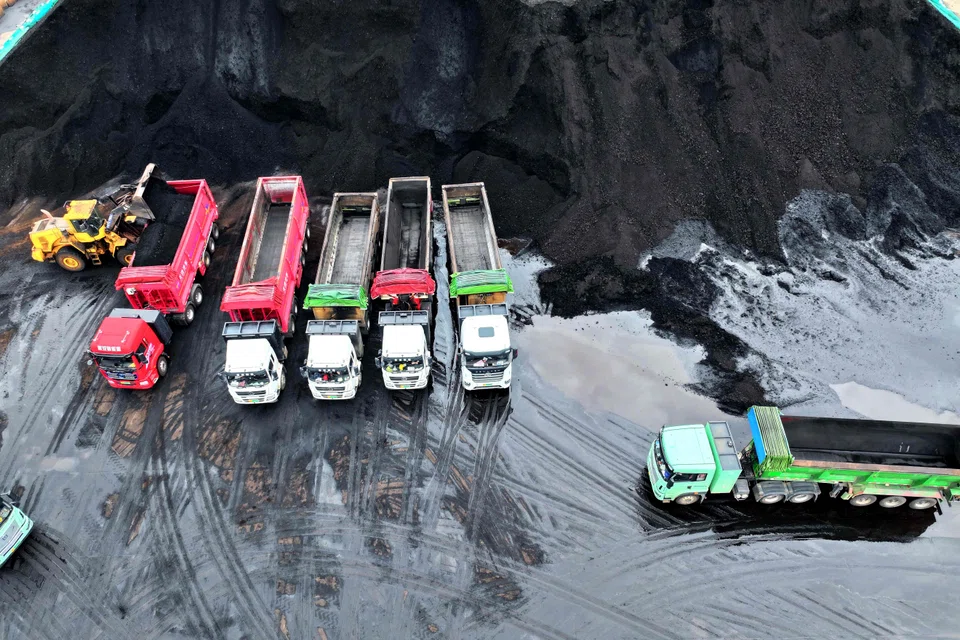 Coal used in power plants is loaded on to trucks at the coal storage facility at the port in Lianyungang, in China’s eastern Jiangsu province.