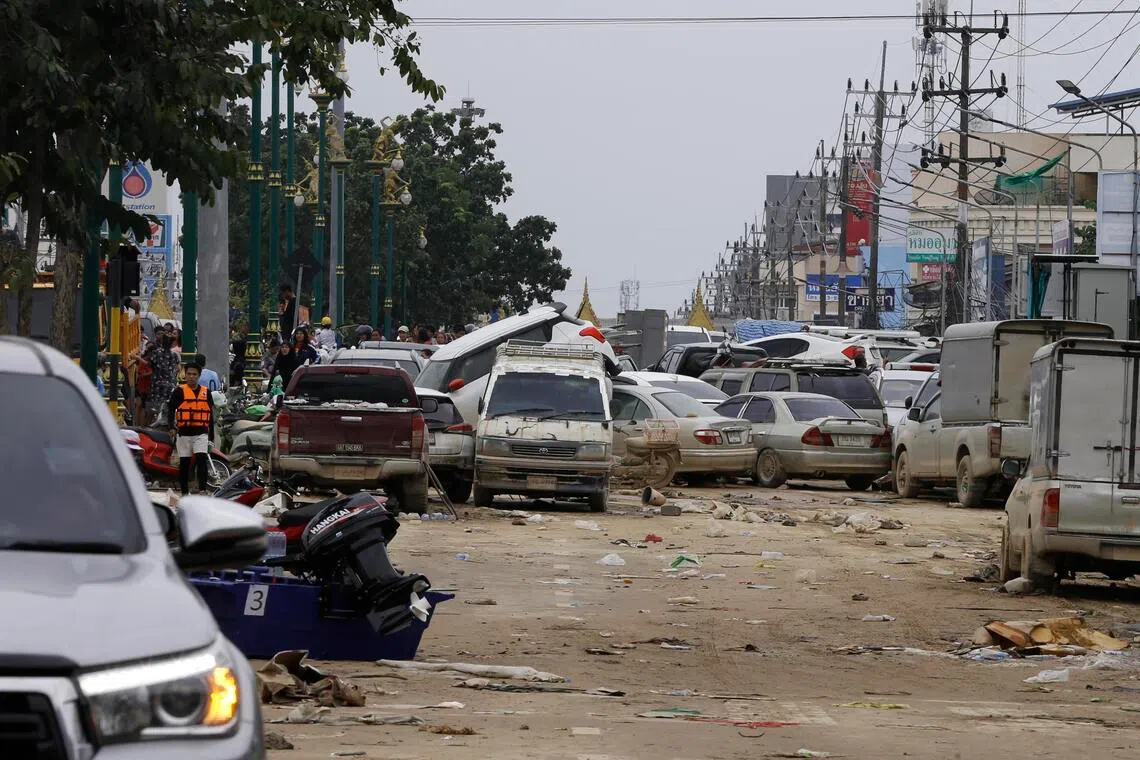 With major roads cut off and rail services suspended, the flow of goods from Thailand to Malaysia has slowed to almost zero.
