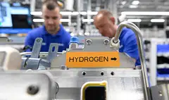 Employees of German technology company Bosch work on a hydrogen-powered fuel-cell module. There is a gold rush brewing in green hydrogen.