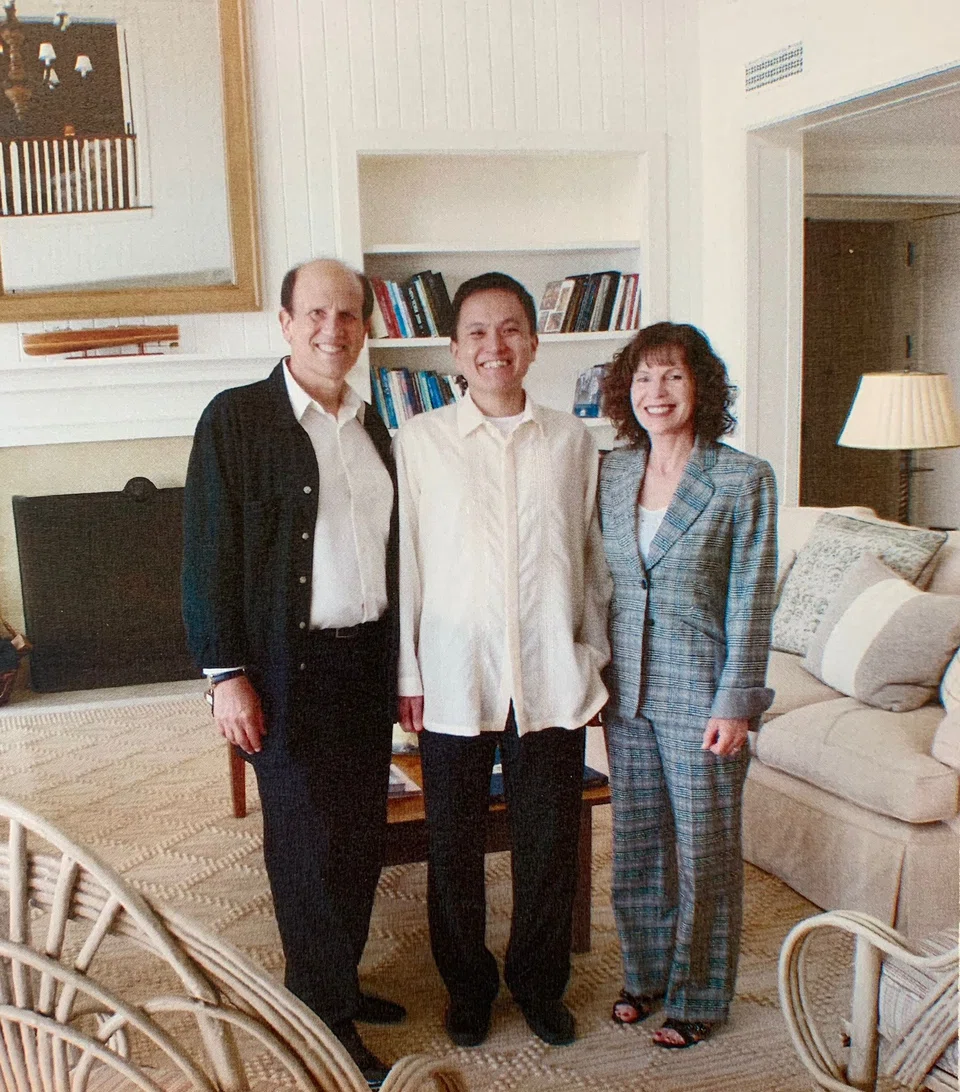 Writer Tan Chin Hwee (centre) with Mike Milken (left) and his wife Lori at their home in California, in 2015.