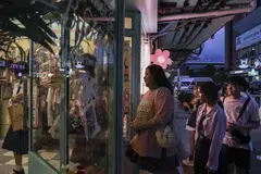 Customers at a store in Bangkok. The government has favoured cutting rates from a decade-high 2.5% to boost consumption and growth.