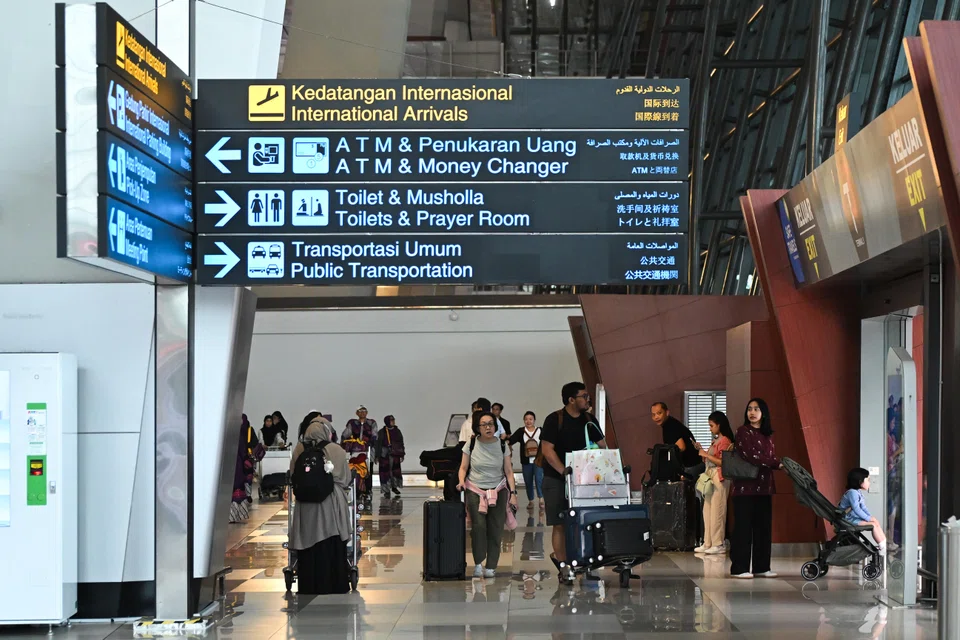 Passengers at Jakarta's international airport. A recent ransomware attack caused widespread disruption and data loss in immigration offices, affecting airport operations and the passport verification system.