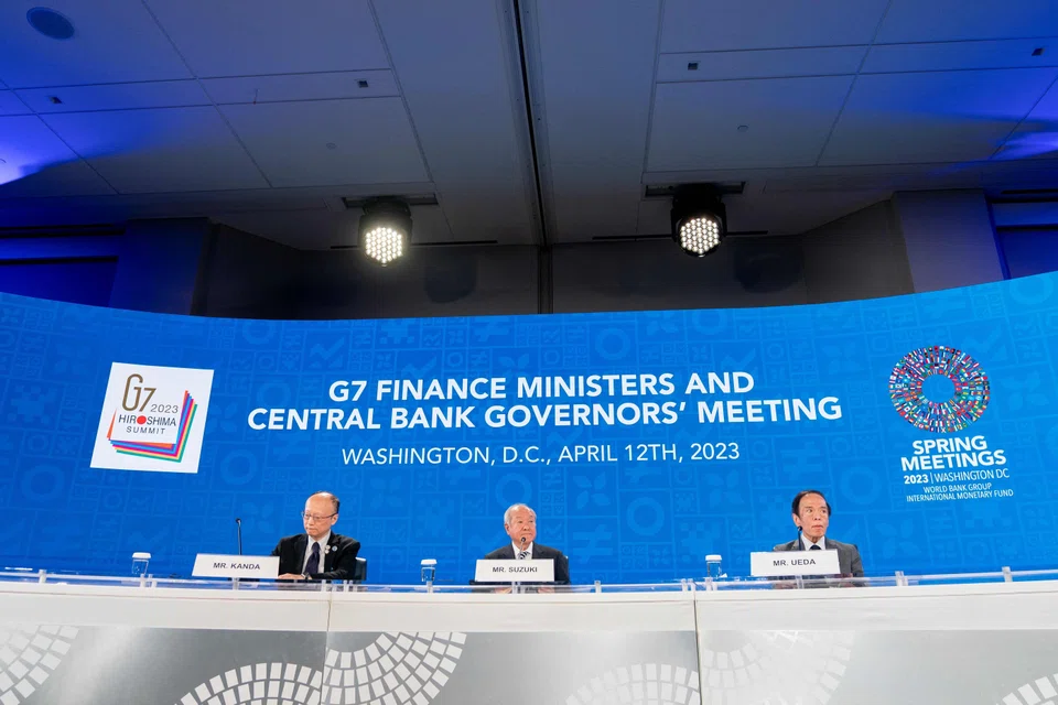 (From left to right) Japanese Finance Vice Minister Masato Kanda, Japanese Finance Minister Shunichi Suzuki and Bank of Japan Governor Kazuo Ueda participate in a G7 press briefing during the IMF and World Bank Spring Meetings at in Washington, DC, on April 12, 2023. 
