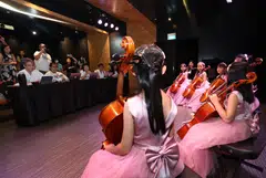 A group of seven girl cellists, aged between seven and 10, impressing the selection panel at ChildAid 2023 auditions.