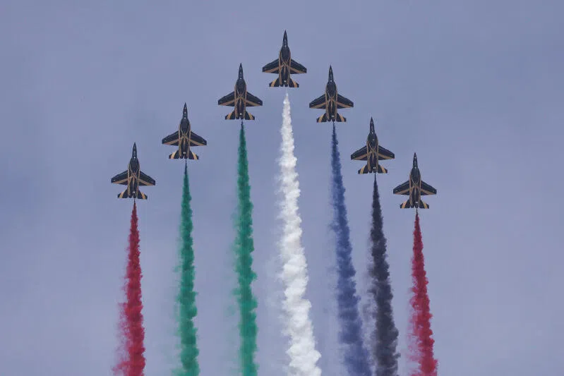 An aerobatic display team performs at the Dubai Airshow in Dubai, United Arab Emirates.