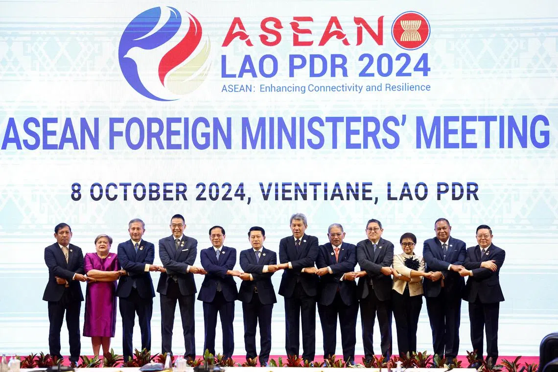 (From left) Myanmar's Permanent Secretary of Foreign Affairs Aung Kyaw Moe, Philippines' Foreign Affairs Undersecretary Ma. Theresa P. Lazaro, Singapore's Foreign Minister Vivian Balakrishnan, Thailand's Foreign Minister Maris Sangiampongsa, Vietnam's Foreign Minister Bui Thanh Son, Laos' Foreign Minister Saleumxay Kommasith, Malaysia's Foreign Minister Mohamad Hasan, Brunei's Second Minister of Foreign Affairs Erywan Yusof, Cambodia's Foreign Minister Sok Chenda Sophea, Indonesia's Foreign Minister Retno Marsudi, East Timor's Foreign Minister Bendito dos Santos Freitas and Asean Secretary General Kao Kim Hourn pose for a photo in Vientiane, Laos, Oct 8, 2024. 
