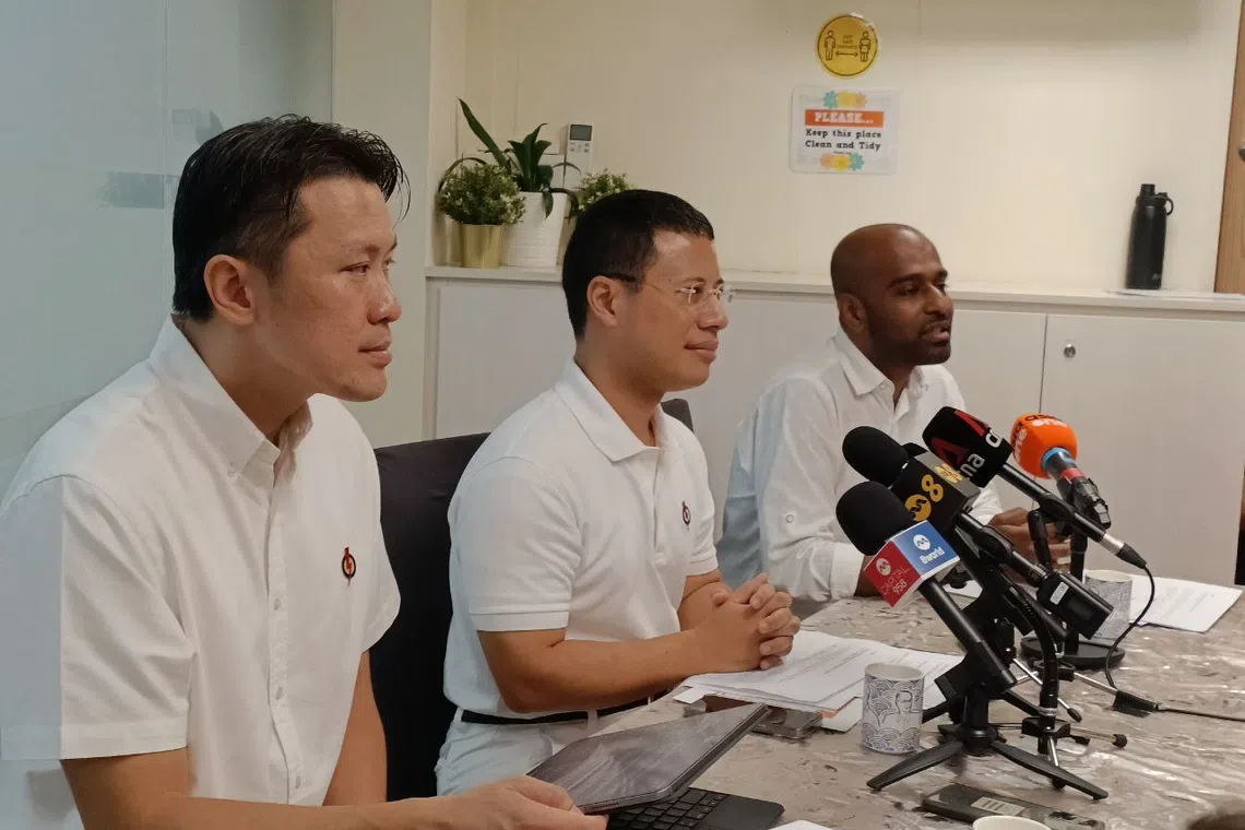 (From left) Senior Parliamentary Secretary Shawn Huang, National Development Minister Desmond Lee and PAP new face Dr Hamid Razak, speaking to reporters at the party’s Boon Lay branch after a walkabout.