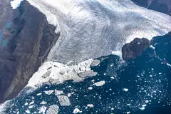 Icebergs and ice sheet in the Baffin Bay near Pituffik, Greenland on July 19, 2022. Global sea ice cover reached a historic low in February 2025, Europe's climate monitor said, with temperatures spiking up to 11 deg C above average near the North Pole as the world continued its persistent heat streak. 