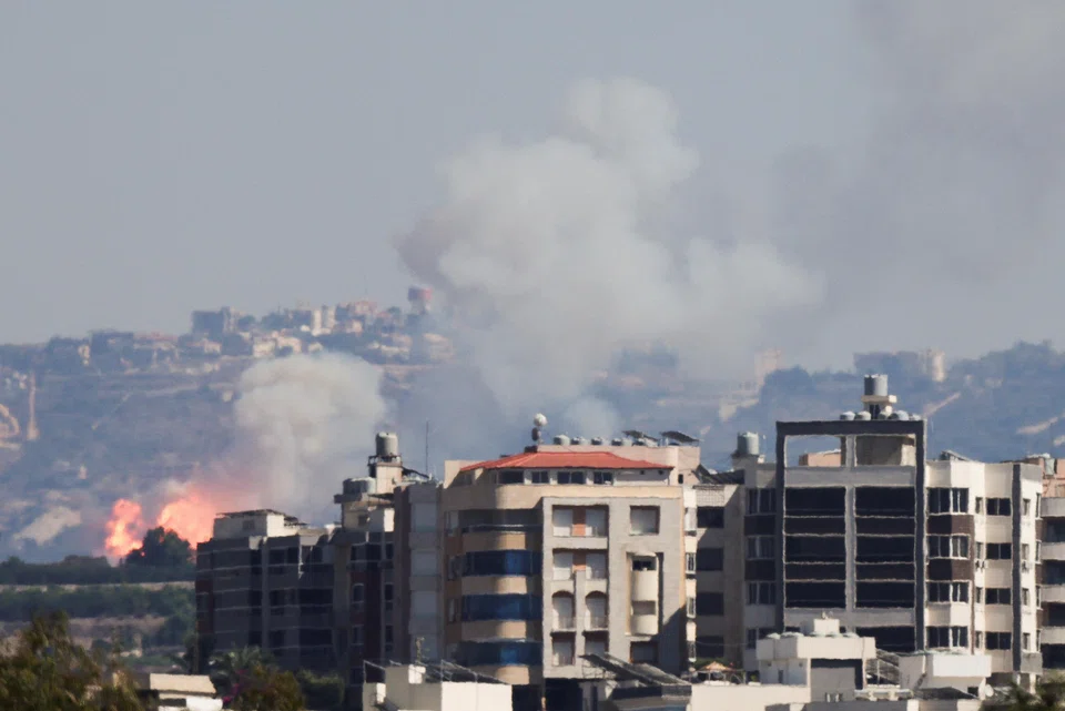 Smoke billows over southern Lebanon following an Israeli strike, amid ongoing cross-border hostilities between Hezbollah and Israeli forces.