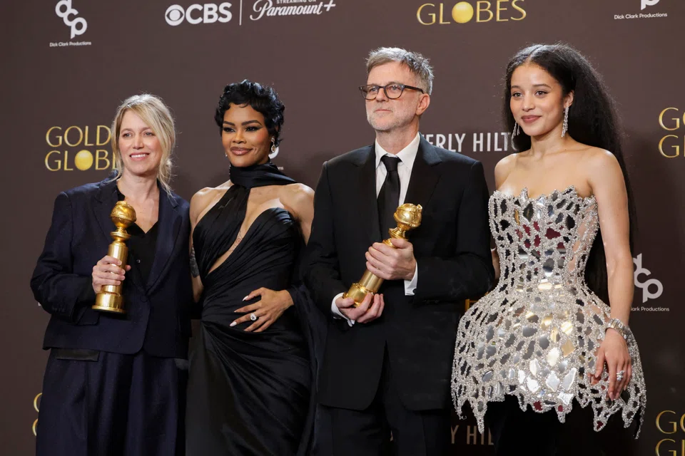 Sara Murphy, Teyana Taylor, Paul Thomas Anderson and Chase Infiniti pose with the Best Motion Picture - Musical or Comedy award for 'One Battle After Another' at the 83rd Annual Golden Globes.
