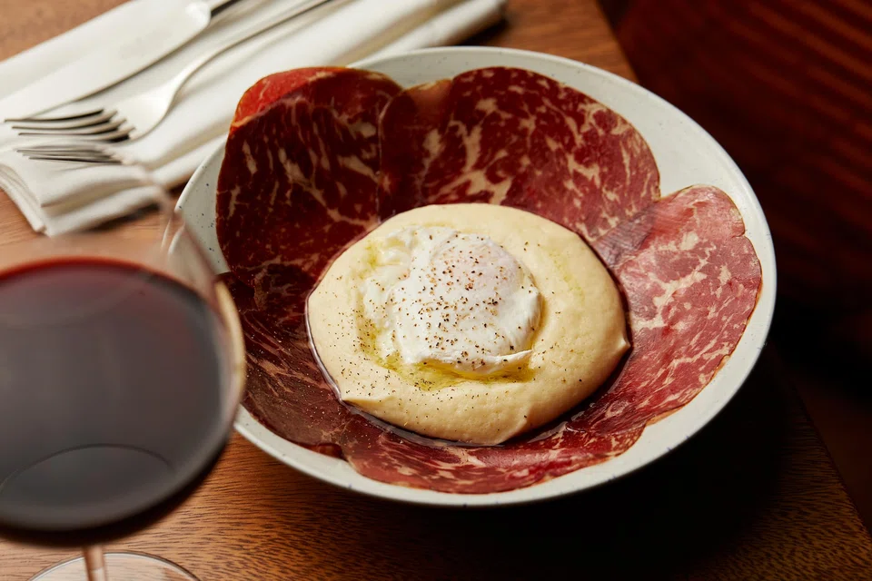 Cecina features air-dried wagyu, truffle potato mousse and poached egg. 