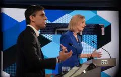 Candidates Rishi Sunak and Liz Truss take part in the BBC Conservative party leadership debate  on July 25, 2022.  The Institute for Fiscal Studies accused both  of being irresponsible by offering tax giveaways at a time when borrowing is already set to overshoot. 