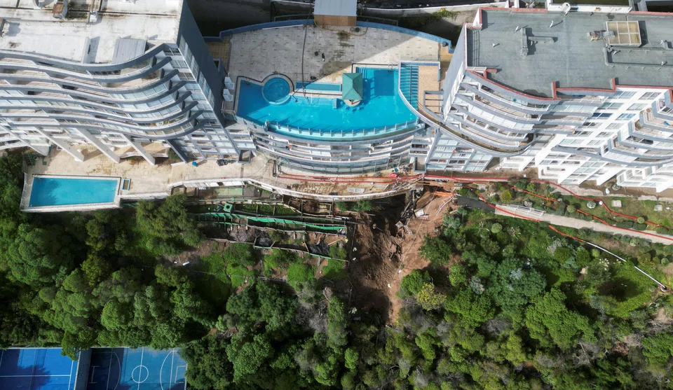 Intense rains that have lashed Chile in recent days caused a giant sinkhole to open underneath this high-end property in the resort city of Vina del Mar, prompting the evacuation of hundreds of residents.