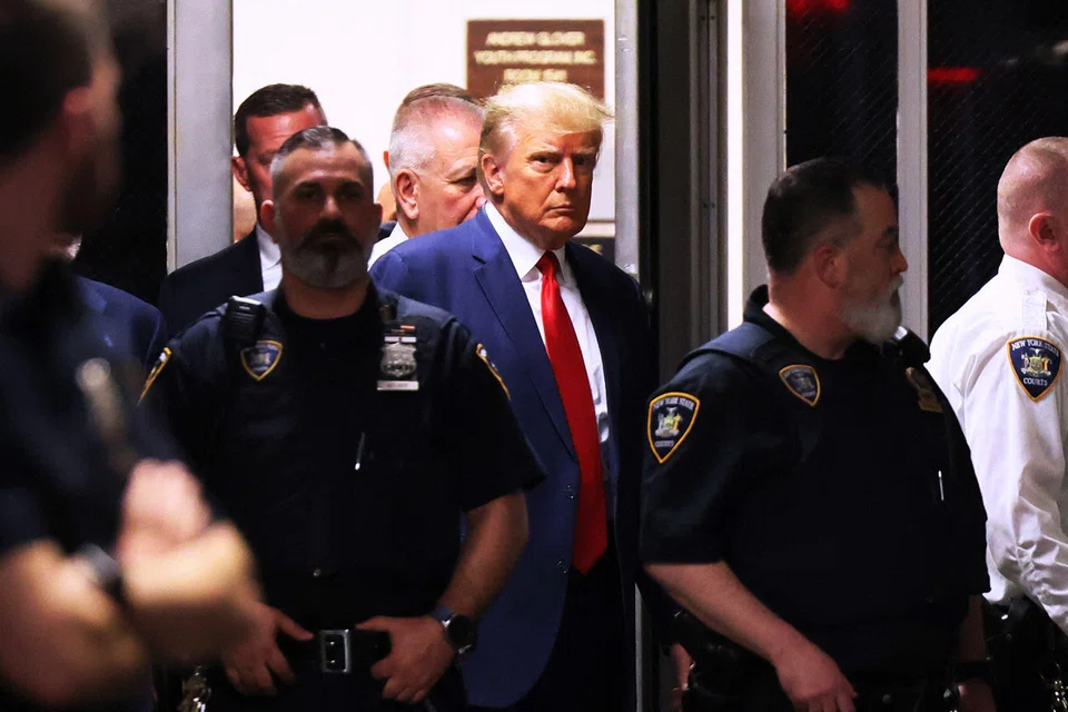 Former US president Donald Trump arrives for his arraignment at Manhattan Criminal Court on Apr 4, 2023, in New York City. 