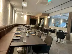 Cuisson's interiors are spacious and plush, with a see-through wine cellar.