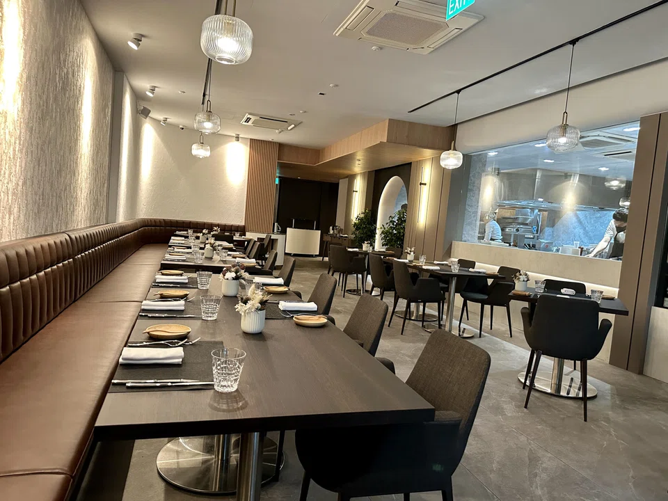 Cuisson's interiors are spacious and plush, with a see-through wine cellar.