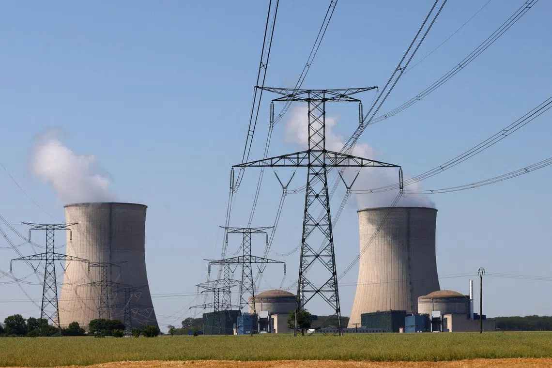 The cooling towers and reactors of a nuclear power plant in France. While older versions of conventional nuclear reactors are unfeasible in Singapore, small modular reactors and Generation IV thermal reactors "could potentially suit our needs", Dr Tan says.