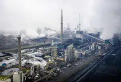 Blast furnaces of Tata Steel in IJmuiden, the Netherlands. The EU's new carbon border adjustment mechanism (CBAM) complements its EU Emissions Trading System (ETS) designed to reduce emissions from power and industry plants. 
