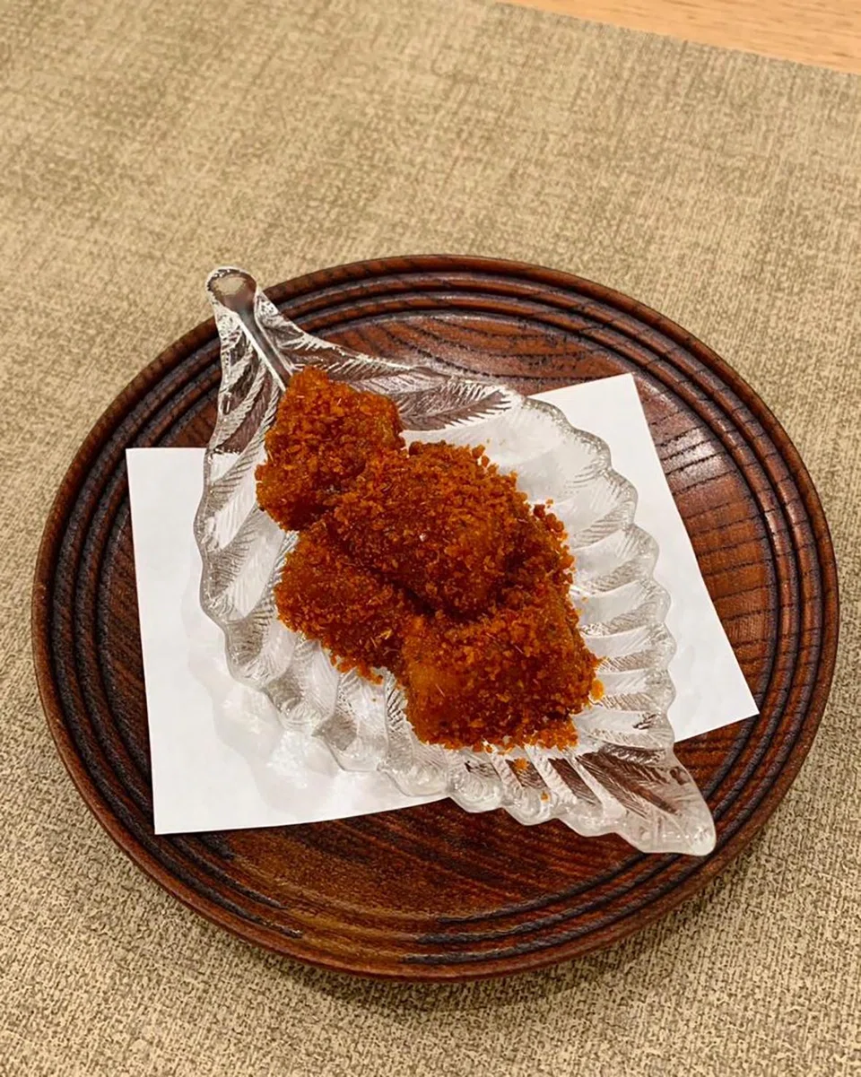 Muah chee gets the savoury treatment with a coating of spicy prawn floss.