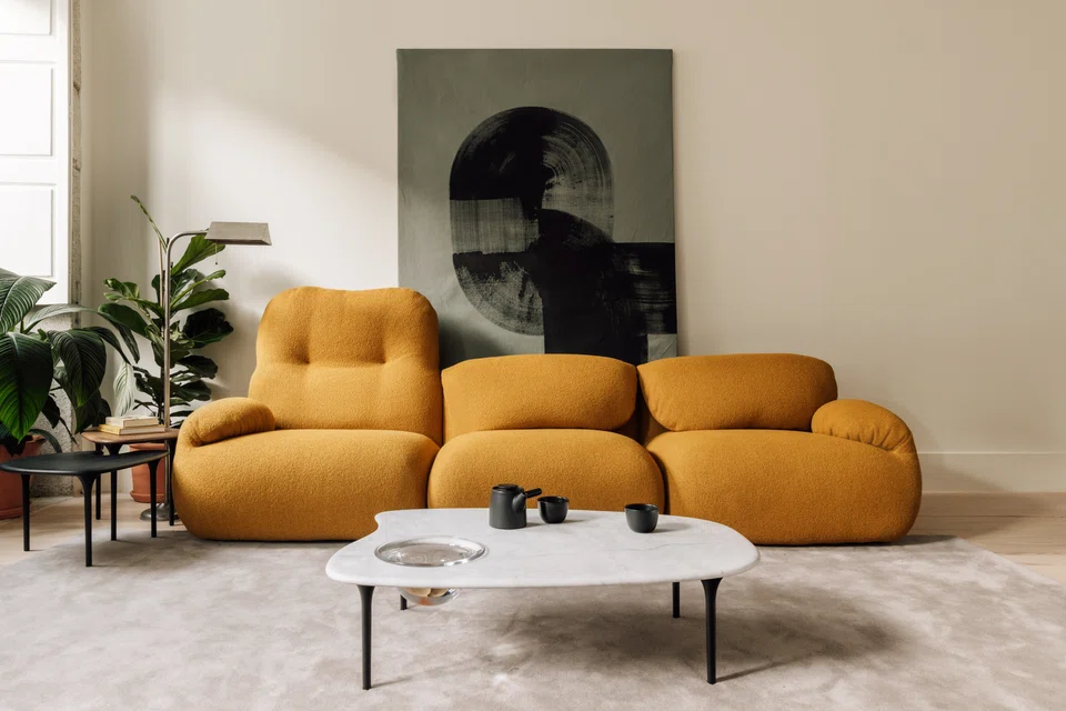 The Luva modular sofa and Cyclade tables, pictured here in Tan's Porto home, are his debut collections for Herman Miller. 