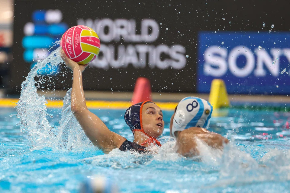 Bente Rogge of the Netherlands (left) in action against Carla Comba of Argentina during a women's water polo match at the World Aquatics Championships on July 11.