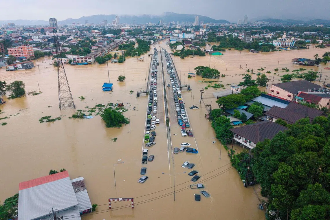 Floodwaters submerging vehicles in Hat Yai, southern Thailand, in late November. At least 34 people died, and thousands more were displaced. 