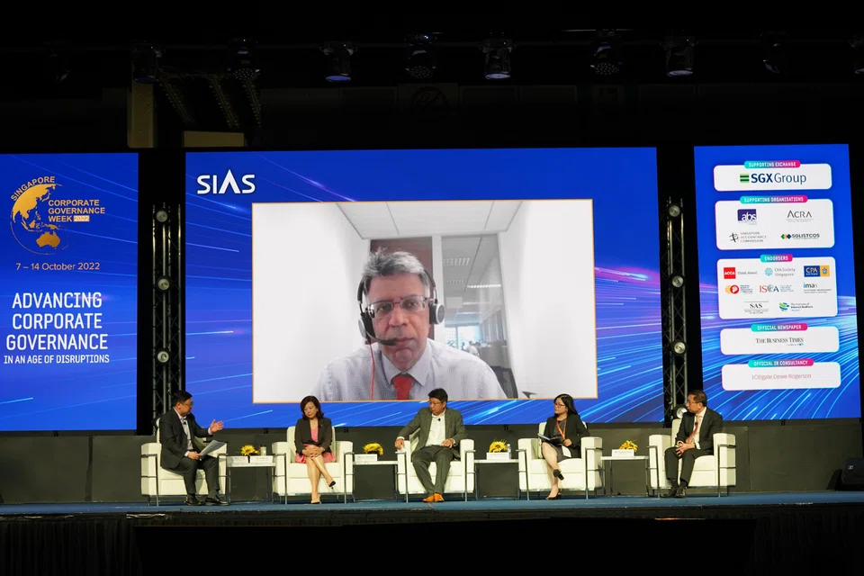Panellists at the Sias conference talking about how ESG investing shouldn't be about chasing the returns, but about using the capital to compel companies to make better choices. On screen: Amar Gill of BlackRock. Seated L-R: Melvin Yong of CPA Australia, Esther An of City Development Limited, Loh Uantchern of Sias and Black Sun, Nga Pham of Monash Centre for Financial Studies and Tay Woon Teck of RSM Singapore.