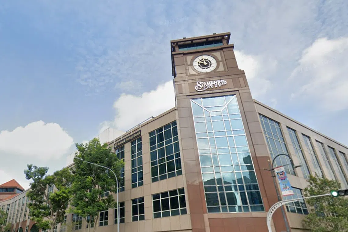 Four-storey Stamford Court has a distinctive clock tower on the building’s granite and glass facade. 