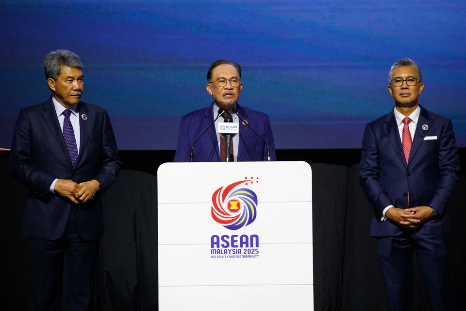 Malaysia's Prime Minister Anwar Ibrahim (centre) with Mohamad Hasan (left), the country's foreign affairs minister, and Tengku Zafrul Aziz, the investment, trade and industry minister, at the close of the 46th Asean Summit in Kuala Lumpur.