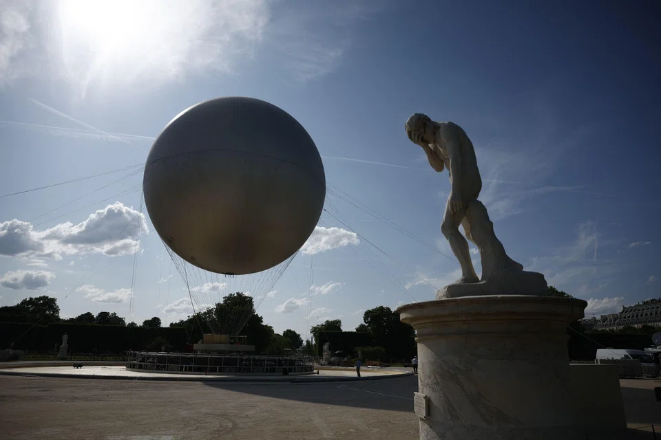 The Olympic cauldron at the Tuileries Garden in Paris. The cauldron will rise each evening from Jun 21 to Sep 14 until the 2028 Olympic Games in Los Angeles.