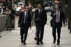 Michael Nowak (centre) and 2 of his former colleagues face criminal charges for thousands of so-called spoofing trades, which prosecutors say were used for years to generate illicit gains for JPMorgan and its top clients. 