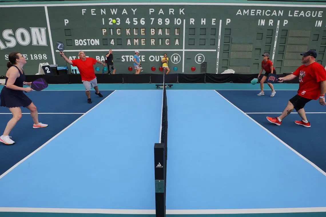 Diane and Phil Schiavo play pickleball against Lori Vickery and Frank Laratonda during the 2023 Ballpark Series at Fenway Park, home of Major League Baseball’s Boston Red Sox, in Boston, Massachusetts, US, July 14, 2023.     