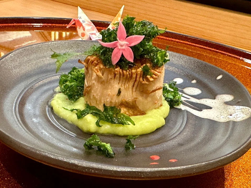 A king oyster mushroom is deftly snipped to resemble the ridges of Hokkaido scallop.