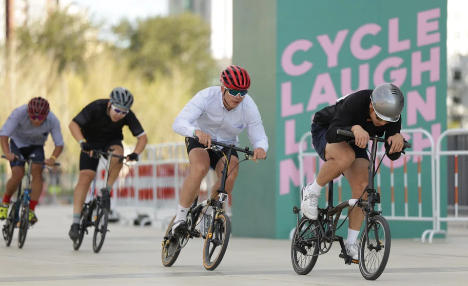 Cyclists racing around the circuit during the last Brompton World Championship in Shanghai in October 2025.