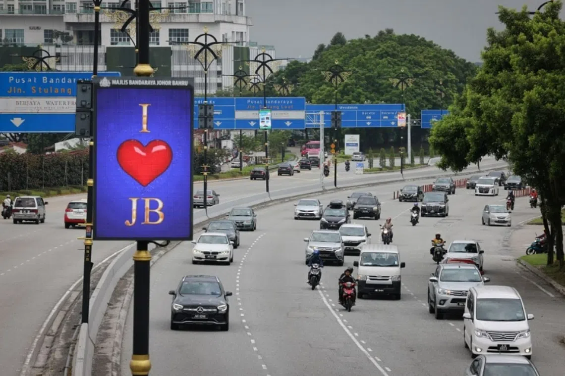 Traffic arriving from Singapore's Woodlands checkpoint into Johor Bahru on Oct 1. 