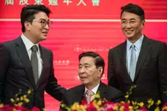 Peter Lee Ka-Kit (right) and Martin Lee Ka-Shing (left) appear as equal controllers of the shares through three different vehicles.
