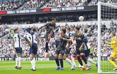 Arsenal's Gabriel Magalhaes (wearing black, jumping) scored with this header to seal a 1-0 win against Tottenham in the EPL on Sep 15, 2024.