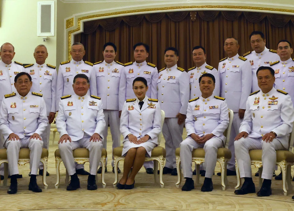Pheu Thai Party's leader and new Prime Minister Paetongtarn Shinawatra (C) with some members of her Cabinet ahead of being sworn in before the king, at Government House in Bangkok.