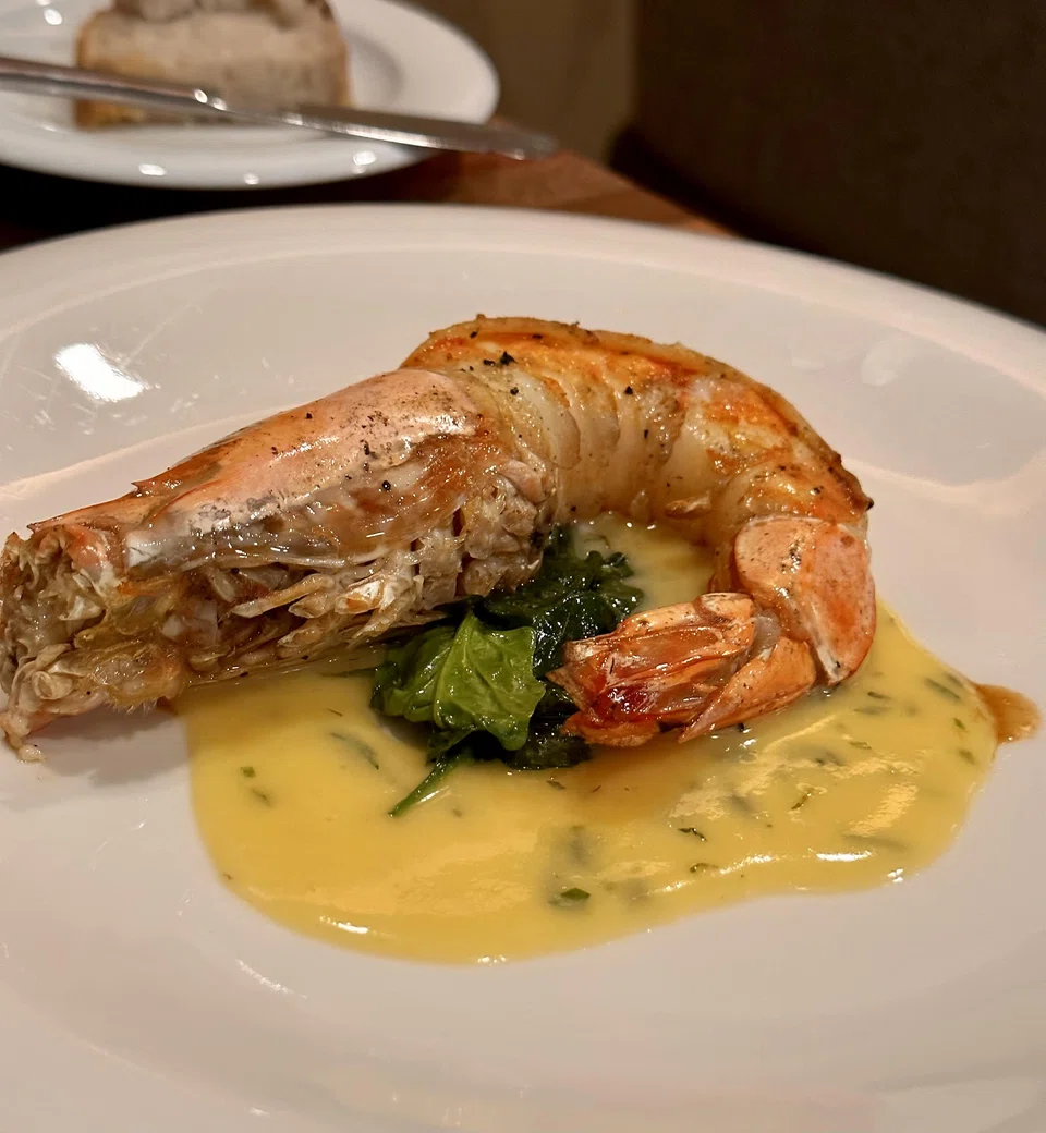jJuicy and meaty king prawn in lemony vin jaune sauce.