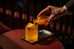 Autumnal Amber is a riff on the classic Penicillin, where rum replaces Scotch and spiced pumpkin replaces ginger, swirled with Laphroaig.