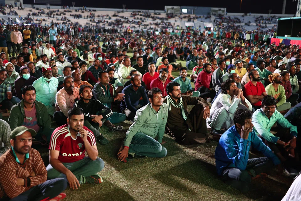 Migrant workers in Qatar watch the Qatar vs Ecuador match, Nov 20, 2022. Fifa had confirmed support for a permanent International Labour Organization (ILO) office in Doha that would support and advise migrant workers. 