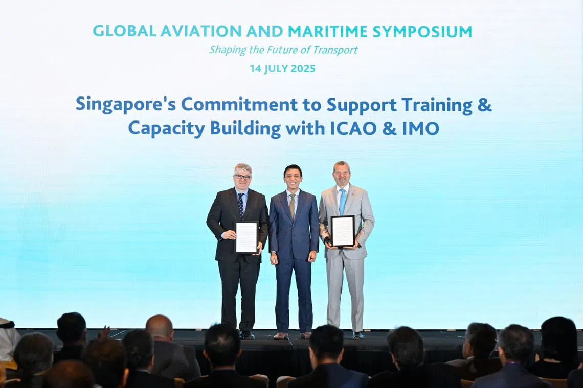 Acting Minister for Transport Jeffrey Siow with Juan Carlos Salazar, secretary-general, ICAO (left), and Arsenio Dominguez, secretary-general, IMO, at the opening ceremony of the Global Aviation and Maritime Symposium. 