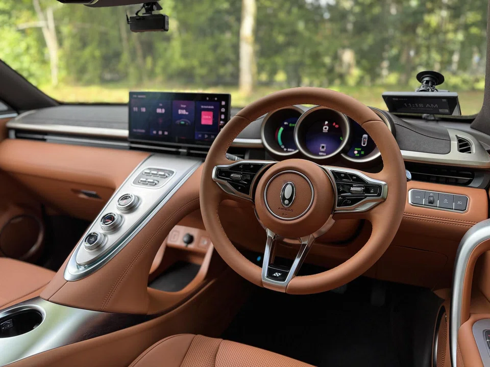 It's all soft curves inside the cabin, with a tasteful mix of pastel tones and metallic finishes.