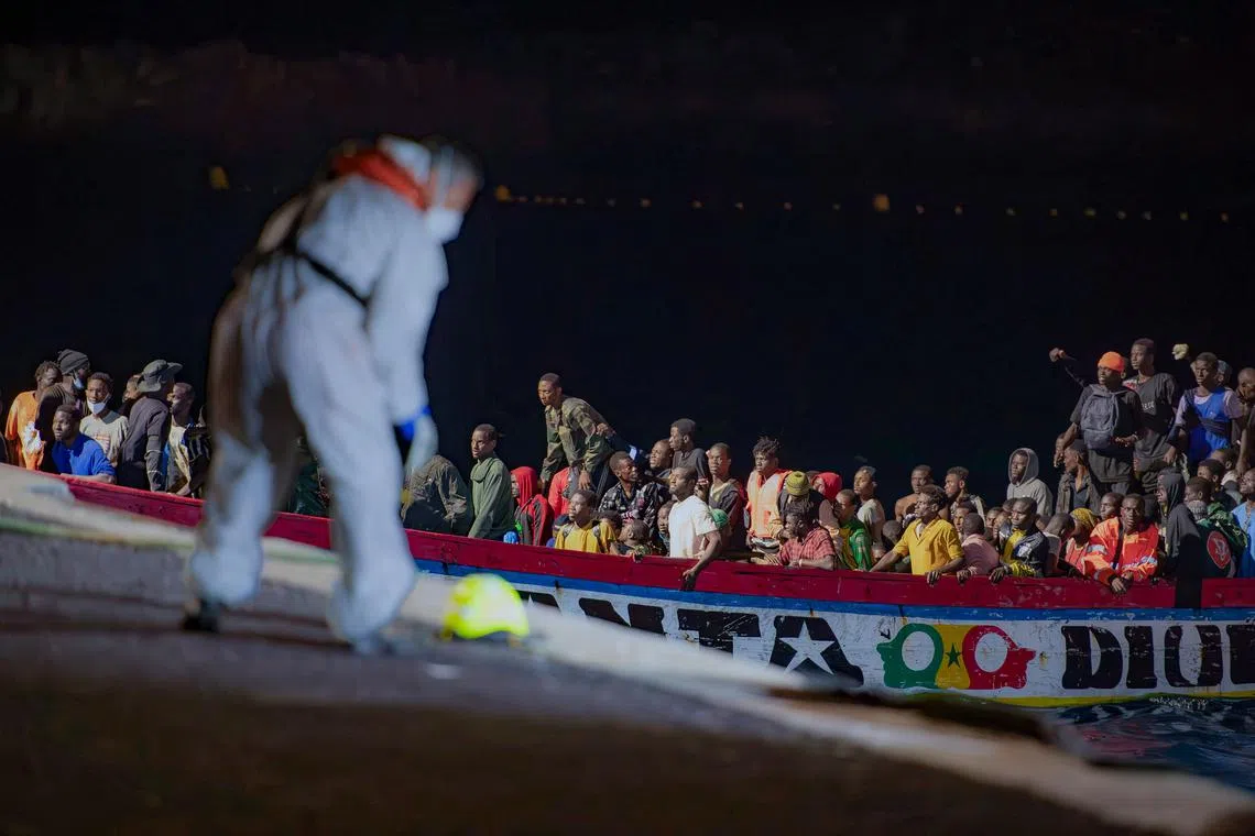 Migrants on a boat arriving at the Canary island of El Hierro. Tens of millions of people are likely to flee Africa and Latin America in the coming years, driven by political and economic challenges and climate change. 