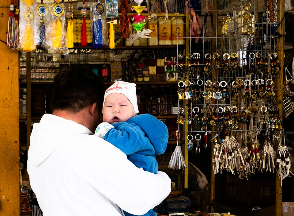 A parent and child at a local market.
