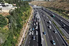 People attempting to block traffic during a protest against Israeli Prime Minister Benjamin Netanyahu's government amid the ongoing conflict in Gaza between Israel and Hamas, in Jerusalem, Israel, June 17, 2024. 