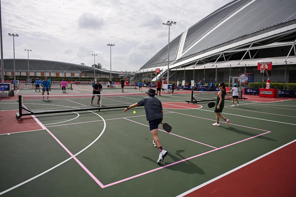 Pickleball players at the new dual-use courts at The Kallang. Two junior courts at the Kallang Tennis Hub and three courts at the Promenade at National Stadium have been modified into dual-use courts that can be used for pickleball, tennis or basketball.