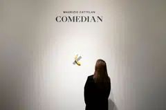A visitor ate the banana that was part of Maurizio Cattelan's work "Comedian", estimated at several million euros and presented in the exhibition "Dimanche sans fin" at the Centre Pompidou in Metz, France, July 18, 2025. 