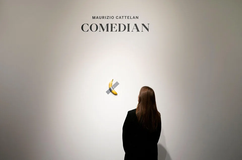 A visitor ate the banana that was part of Maurizio Cattelan's work "Comedian", estimated at several million euros and presented in the exhibition "Dimanche sans fin" at the Centre Pompidou in Metz, France, July 18, 2025. 