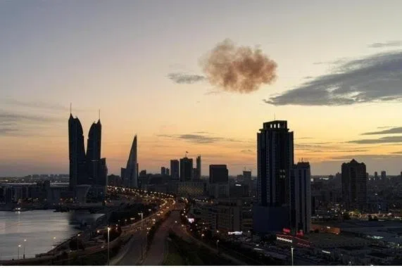 Smoke rising after an Iranian drone was intercepted over the Bahrain Financial Harbour towers, which house the Israeli embassy, March 6., 2026.